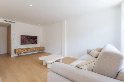 a living room with a couch and a table at Sublime 3 pièces entièrement rénové dans le centre de Cannes in Cannes