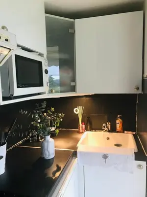 a kitchen with a sink and a microwave at Le Seaview - Calm - Pool - Farniente - Sea view in Cannes