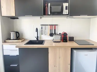 a kitchen counter with a sink and a microwave at Carré d'Or F1bis Croisette 1 mn Olam Properties in Cannes
