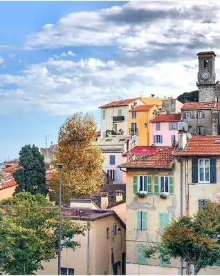 a group of buildings with a clock tower at Carré d'Or F1bis Croisette 1 mn Olam Properties in Cannes