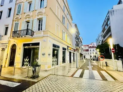 a city street with buildings and a street with a building at Carré d'Or F1bis Croisette 1 mn Olam Properties in Cannes