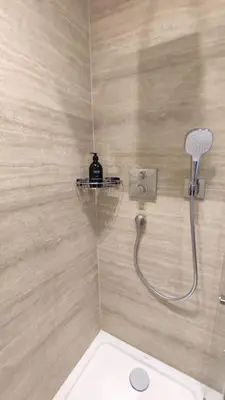 a bathroom with a shower with a toilet and a shower head at Studio rénové, vue dégagée et arborée, 700m plage in Cannes