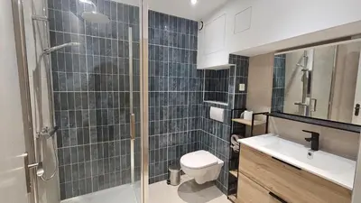 a bathroom with a shower and a toilet and a sink at Studio à Cannes La Bocca in Cannes