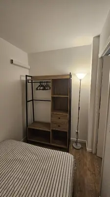a bedroom with a bed and a lamp in it at Studio à Cannes La Bocca in Cannes