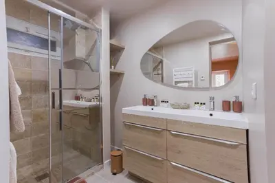 a bathroom with a sink and a mirror at Hakuna Matata Cannes - clim, plages, Palais in Cannes