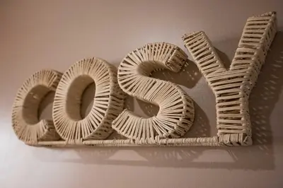 a wooden sign that says love on a wall at Hakuna Matata Cannes - clim, plages, Palais in Cannes