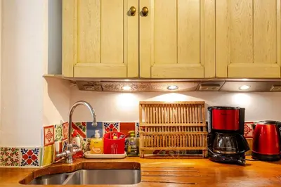 a kitchen with a sink and a counter top at 