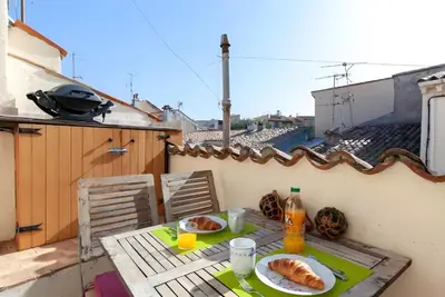 a table with two plates of food on a balcony at 