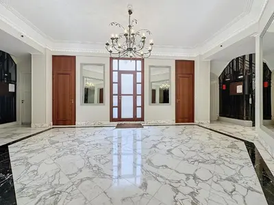 a large room with a marble floor and a chandelier at INTUITION - 2 pieces - Cannes Carre d or in Cannes