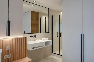 a bathroom with a sink and a mirror at Beautiful 3 bedroom fully renovated in Cannes