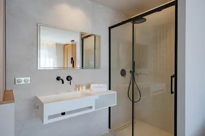 a bathroom with a sink and a shower at Beautiful 3 bedroom fully renovated in Cannes