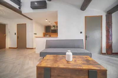a living room with a couch and a table at Immogroom - T3 - Suquet - AC in Cannes