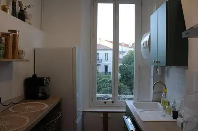 a kitchen with a sink and a window in it at Cocon Spacieux équipé Quartier Prado in Cannes