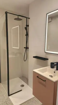 a bathroom with a shower and a sink at Studio calme avec vue sur un grand Pin parasol in Cannes