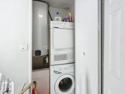 a laundry room with a washer and a washing machine at INTUITION - Cannes centre - 6-8 Couchages in Cannes