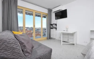 a living room with a couch and a television at Nice Apartment In Cannes With Wifi in Cannes