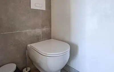 a bathroom with a white toilet in a room at Nice Apartment In Cannes With Wifi in Cannes