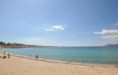 a group of people walking on the beach at Nice Apartment In Cannes With Wifi in Cannes
