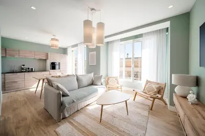 a living room with a couch and a table at REF 1943 - Cannes Centre - Apartment for rent in Cannes