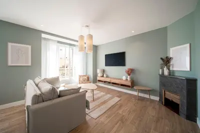 a living room with a couch and a fireplace at REF 1943 - Cannes Centre - Apartment for rent in Cannes
