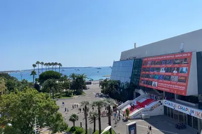 a view of a stadium with the ocean in the background at REF 1943 - Cannes Centre - Apartment for rent in Cannes