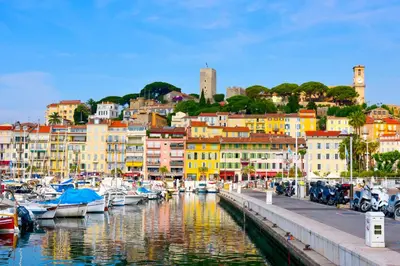a group of boats docked in a harbor with buildings at REF 1943 - Cannes Centre - Apartment for rent in Cannes