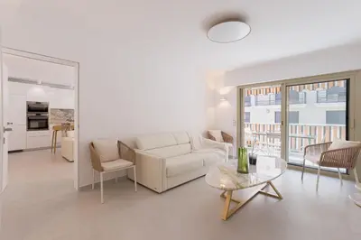 a living room with a white couch and a table at 7 Pradignac Full 3bdrs by Halldis in Cannes