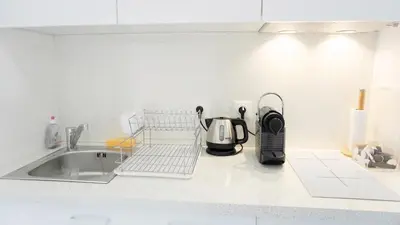 a kitchen counter with a tea kettle and a sink at Proche Palais Des Festivals - Croisette,Studio Bella - Palmazur Vacances in Cannes