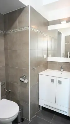 a bathroom with a sink and a toilet and a mirror at Proche Palais Des Festivals - Croisette,Studio Bella - Palmazur Vacances in Cannes