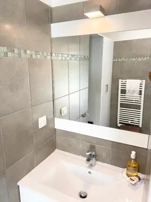 a bathroom with a sink and a mirror at Proche Palais Des Festivals - Croisette,Studio Bella - Palmazur Vacances in Cannes