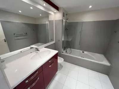 a bathroom with a sink and a tub and a toilet at 204 - Cannes La Croisette - Studio face mer avec balcon in Cannes