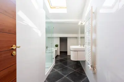 a bathroom with a sink and a mirror at Elegant 1-Br apartment 3 minutes from la Croisette in Cannes