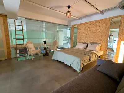 a bedroom with a bed and a table and chairs at Radiance Private Bedroom & Breakfast in Cannes