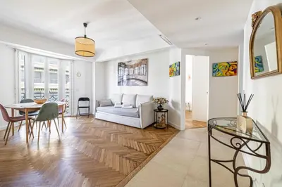 a living room with a couch and a table at Elegance and Refinement, proximity to La Croisette in Cannes