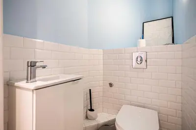a bathroom with a toilet and a sink at Elegance and Refinement, proximity to La Croisette in Cannes