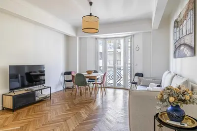 a living room with a couch and a table at Elegance and Refinement, proximity to La Croisette in Cannes