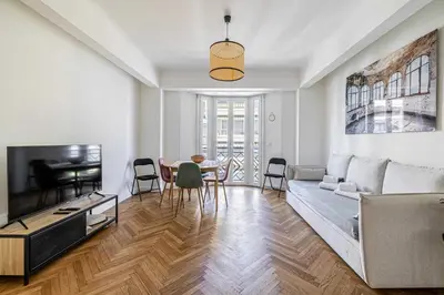 a living room with a couch and a table at Elegance and Refinement, proximity to La Croisette in Cannes