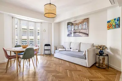 a living room with a couch and a table at Elegance and Refinement, proximity to La Croisette in Cannes