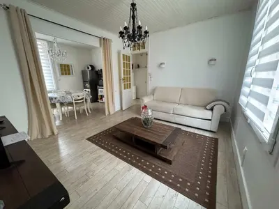 a living room with a couch and a table at C090 Appartement confortable proche du Suquet et du Palais des festivals in Cannes