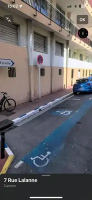 a car parked in a parking lot next to a building at C090 Appartement confortable proche du Suquet et du Palais des festivals in Cannes