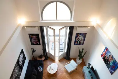 an overhead view of a living room with a window at Triplex Gallia Luxe Cannes in Cannes
