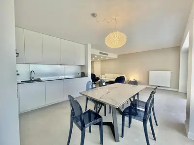 a kitchen and dining room with a table and chairs at Verdalia luxury 3 bedroom by Welcome to Cannes in Cannes