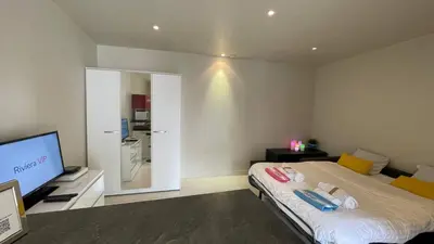 a bedroom with a bed and a flat screen tv at Studio Suquet Near Palais Et Plages in Cannes