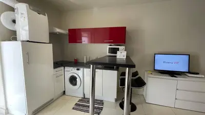 a small kitchen with a desk with a computer on it at Studio Suquet Near Palais Et Plages in Cannes