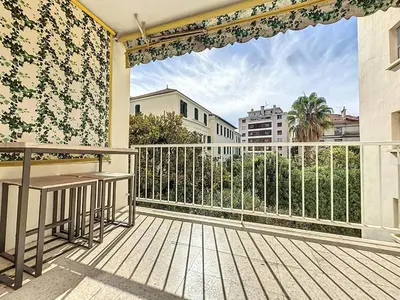 a balcony with a table and a view of a city at INTUITION - 3 pieces - 10min Croisette in Cannes