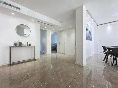 a dining room with a table and a mirror at INTUITION - 3 pieces - 10min Croisette in Cannes