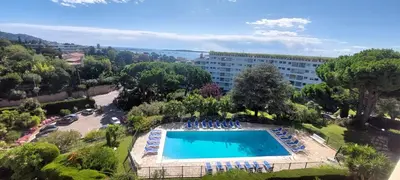 an overhead view of a swimming pool in a resort at Les Orangers - Cannes - Sea View- Swimming Pool - Free Parking - Beach in Cannes