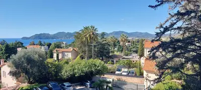 an aerial view of a town with trees and houses at Les Orangers - Cannes - Sea View- Swimming Pool - Free Parking - Beach in Cannes