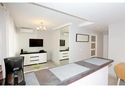 a bedroom with a bed with two towels on it at T2 centre-ville Banane à Cannes avec grande terrasse in Cannes