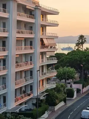 a large apartment building with a road in front of it at New top floor avec vue mer, Croisette à Palm Beach in Cannes